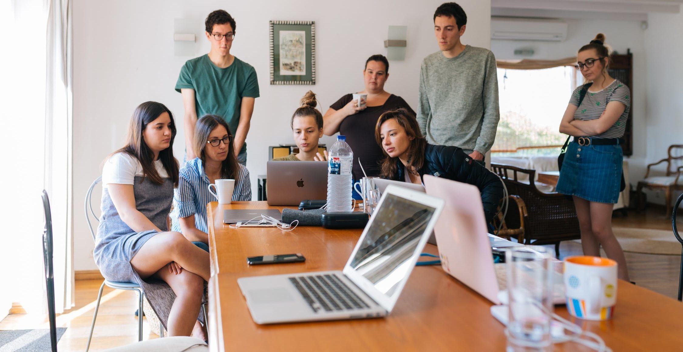 Group of people exploring the FICO score versions.